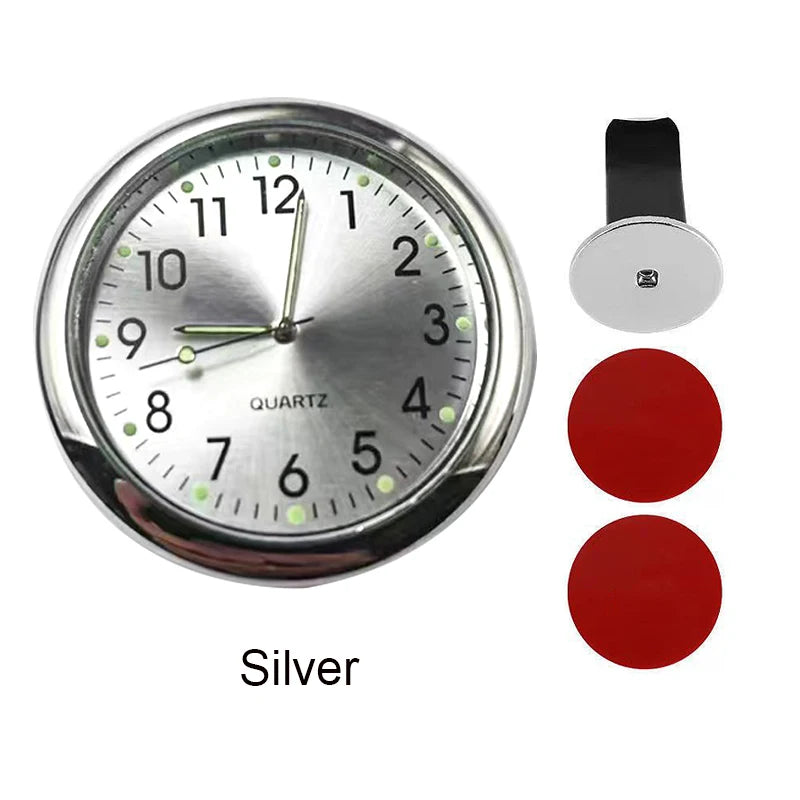 Silver quartz analog clock with a round face and a separate mounting piece.