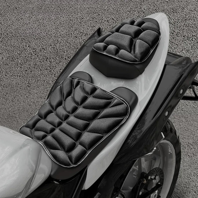 Close-up of black quilted seat covers for a motorcycle or electric bike.