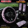 A set of four leopard print plush car accessories including a steering wheel cover and armrest pads.