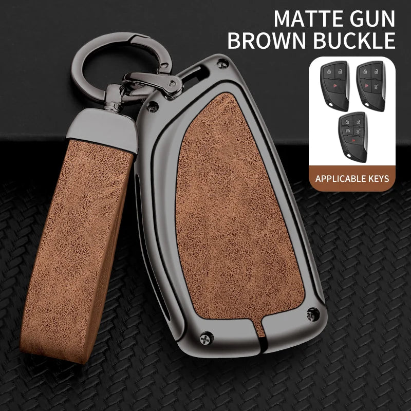A matte gun brown buckle key case with a silver buckle and multiple keys displayed on a black background.