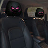 Two black horror-themed car headrest covers with glowing purple smiles installed in a vehicle interior.