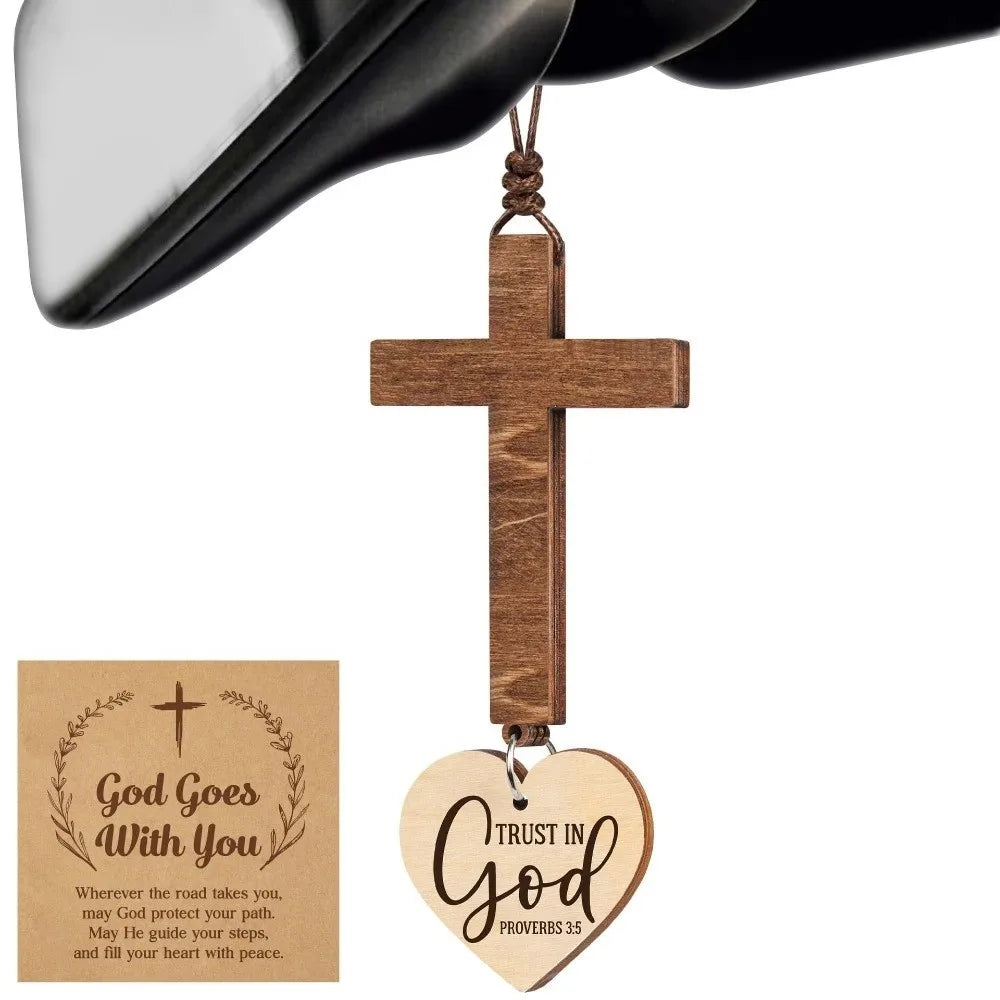 A wooden cross pendant with engraved text Trust in God Proverbs 3:5 for a faith reminder ornament.