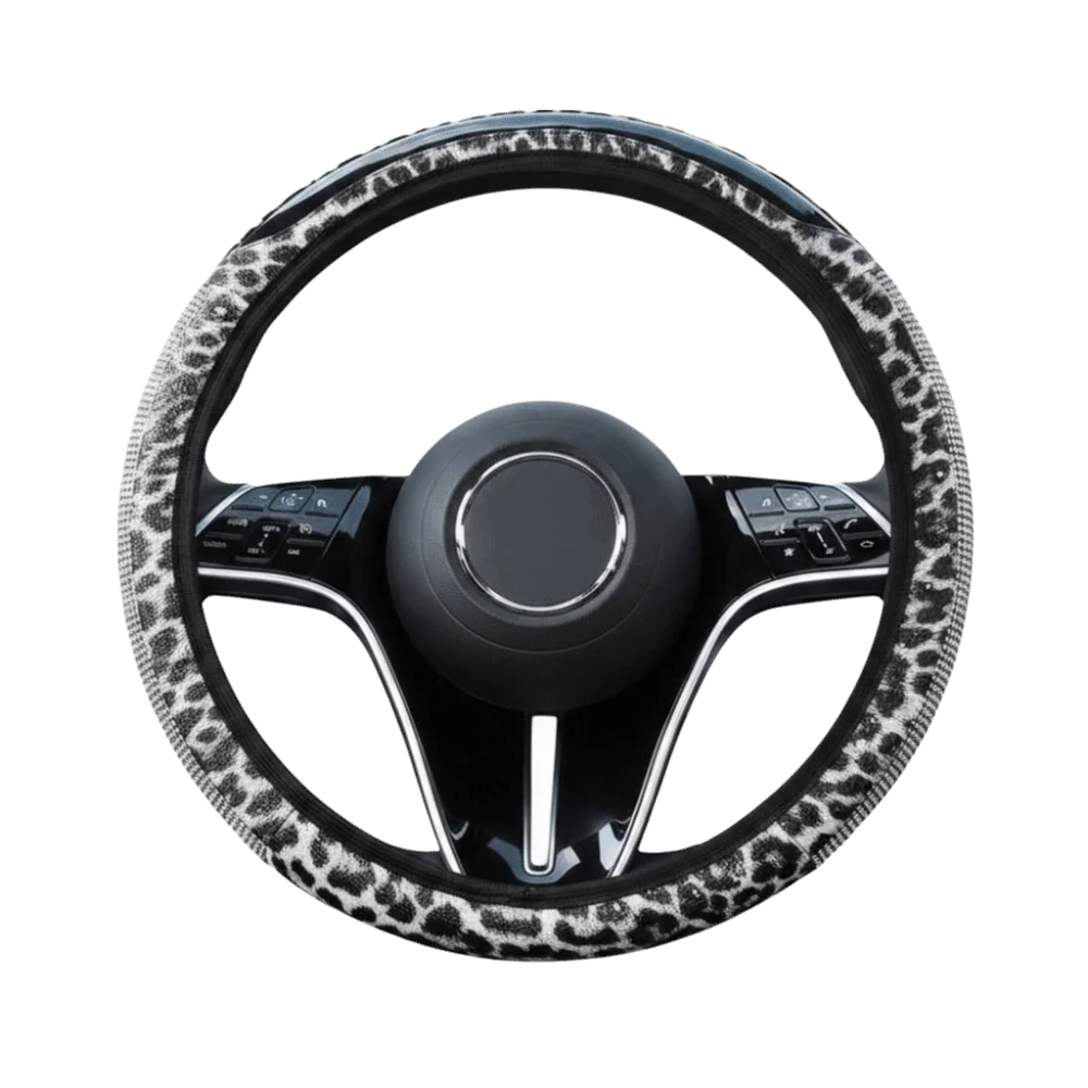 A black steering wheel covered in a leopard print material with silver rhinestone accents.