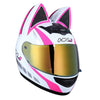 A white and pink cat-ear full face motorcycle helmet with a gold visor.