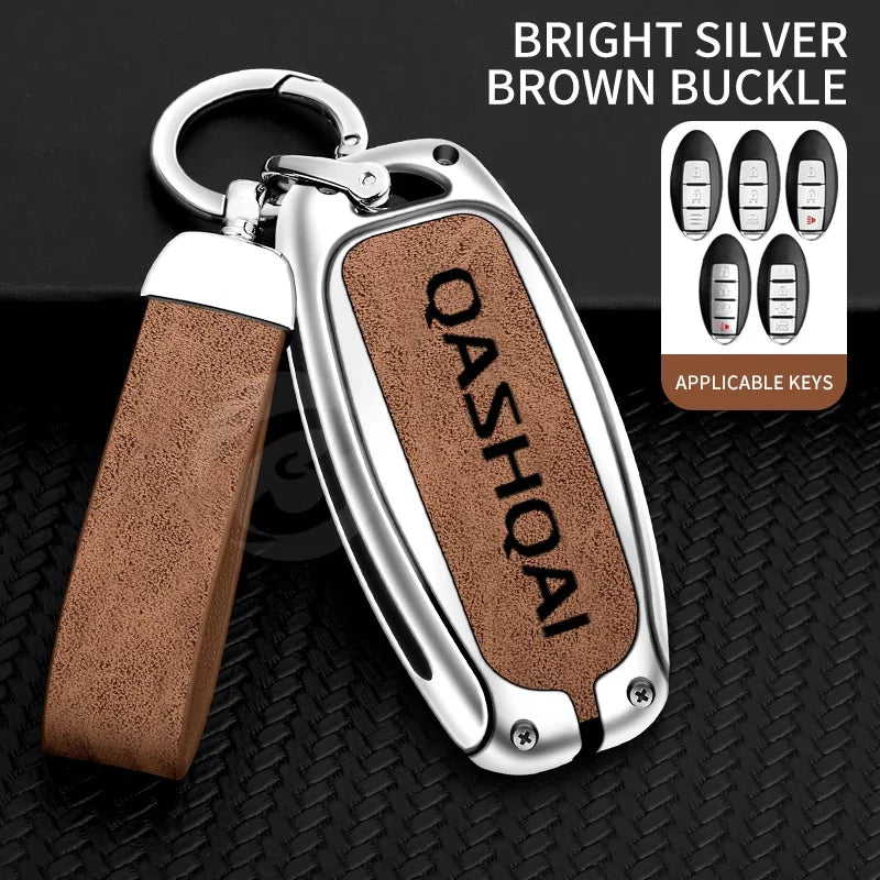 A silver key cover with a brown buckle and leather strap is shown next to applicable keys.
