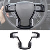 Black carbon fiber trim pieces designed to fit the steering wheel of a Ford truck or SUV
