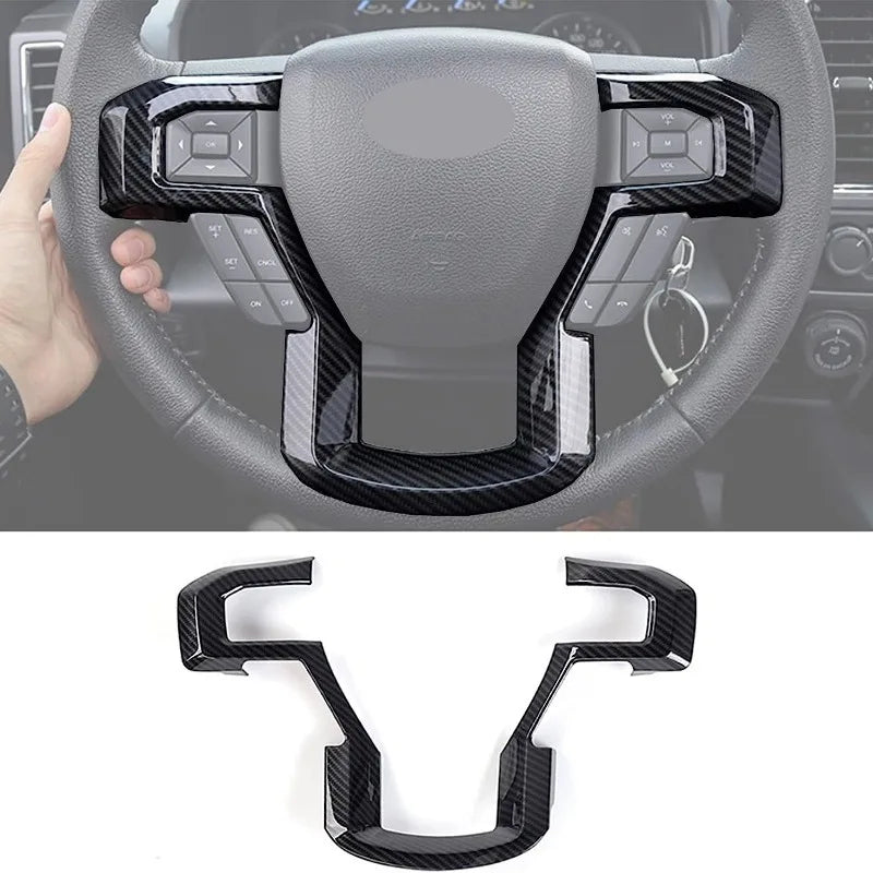 Black carbon fiber trim pieces designed to fit the steering wheel of a Ford truck or SUV