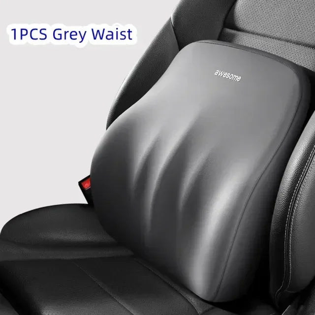 A grey waist cushion is shown placed on a black car seat or chair.