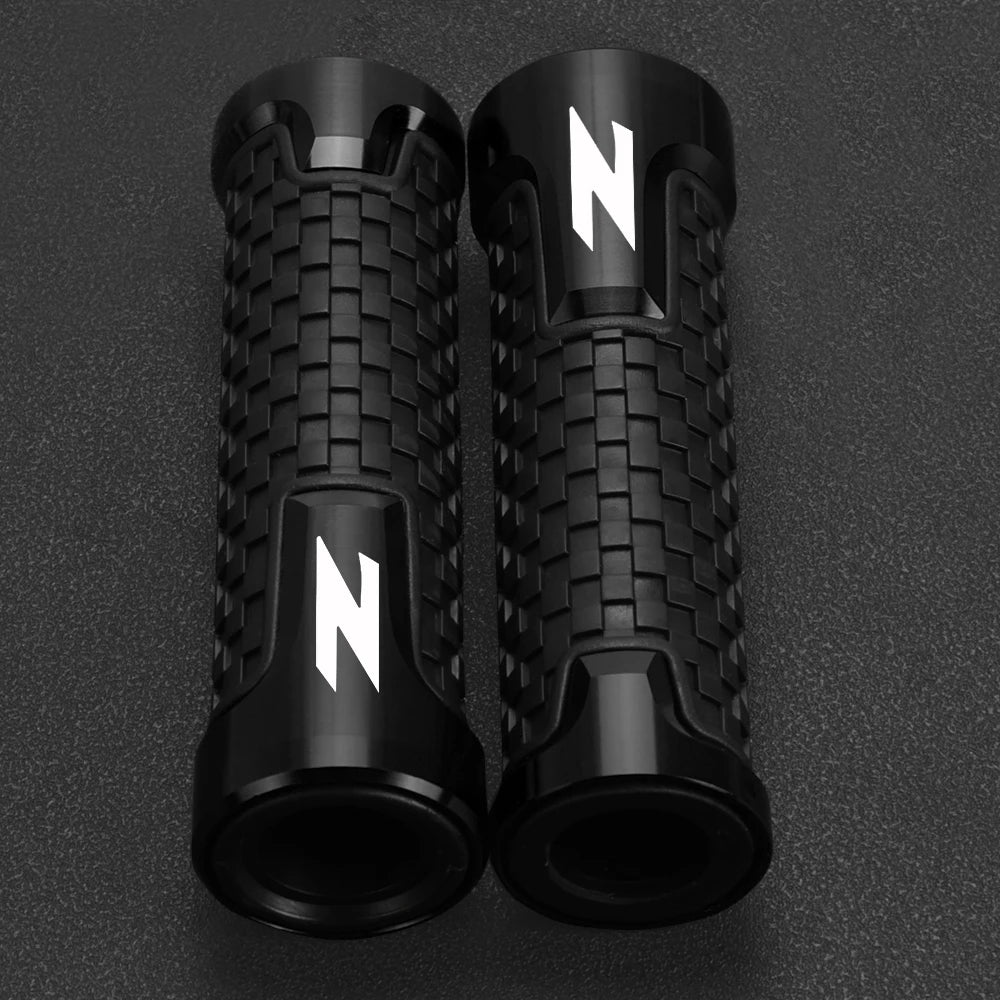 A pair of black motorcycle lever and handguard protector sets with white 'N' markings.