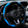 A black steering wheel with a blue accent cover and carbon fiber grip on a car interior.