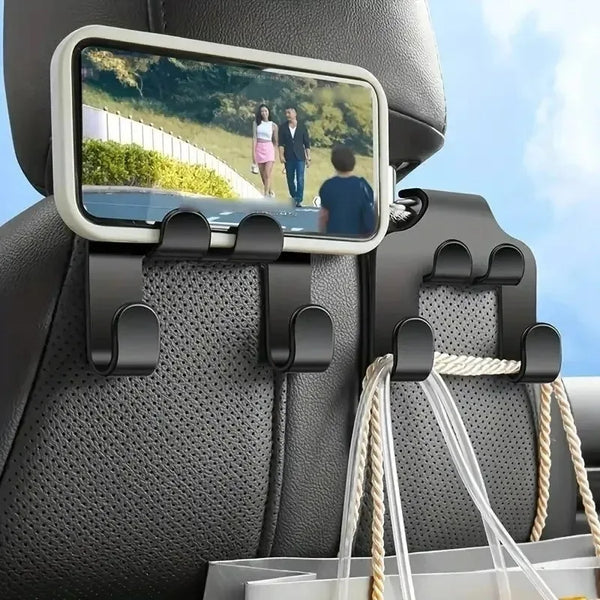 A black car seat features a mounted mobile phone holder with a clear display and storage hooks.