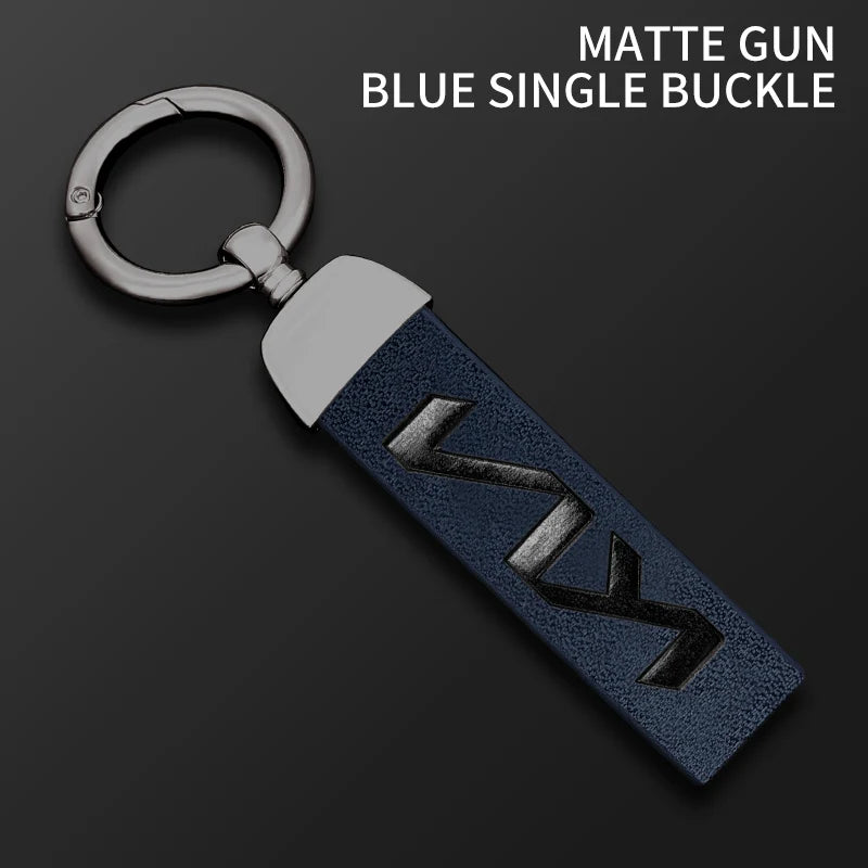 A matte blue single buckle gun key featuring a silver ring and dark blue leather grip.