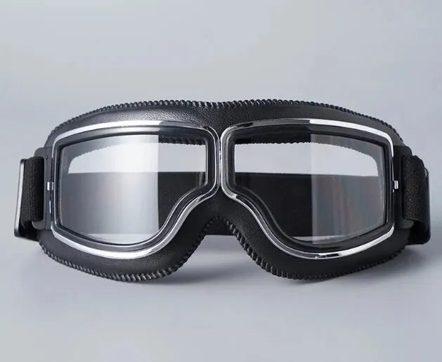 A pair of black retro folding motorcycle windproof glasses with clear lenses and black elastic straps.