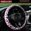 Leopard print plush steering wheel cover installed in a car interior.