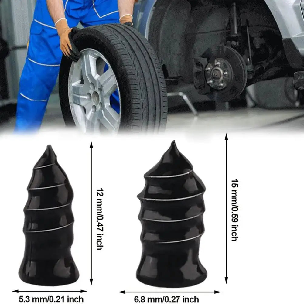 A set of black rubber tyre plugs for car puncture repair, shown next to a tire and a person's leg.