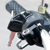 Close-up of a heavy duty anti-theft helmet lock mechanism attached to a motorcycle or bicycle handlebar.