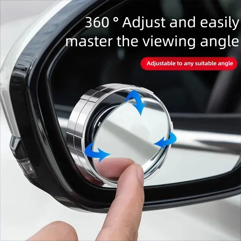 A hand adjusts a 360 degree adjustable blind spot mirror for a vehicle.