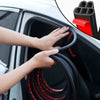 Hands are installing black and red car door soundproofing seals into the vehicle door frame.