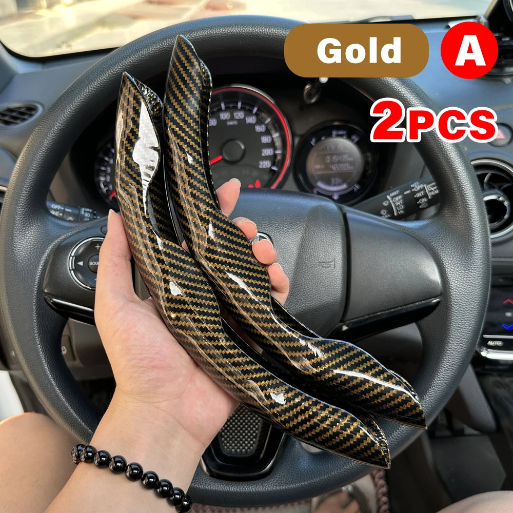 Gold A 2PCS universal car steering wheel booster cover shown being held in a car interior.