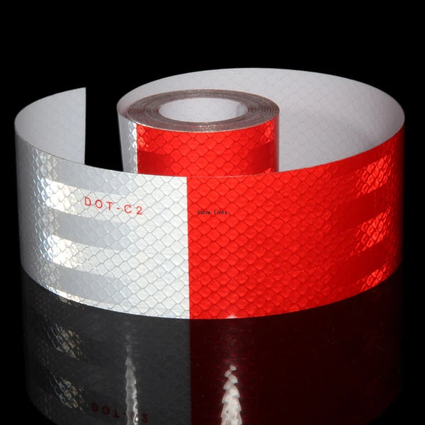 Roll of high-visibility reflective safety tape in white and red stripes viewed from the side.