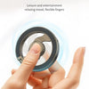 A hand is using a fingertip gyroscope device to relax, demonstrating its flexible fingers.