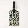 Black leather passport holder with leopard print design and a gold-toned clasp.