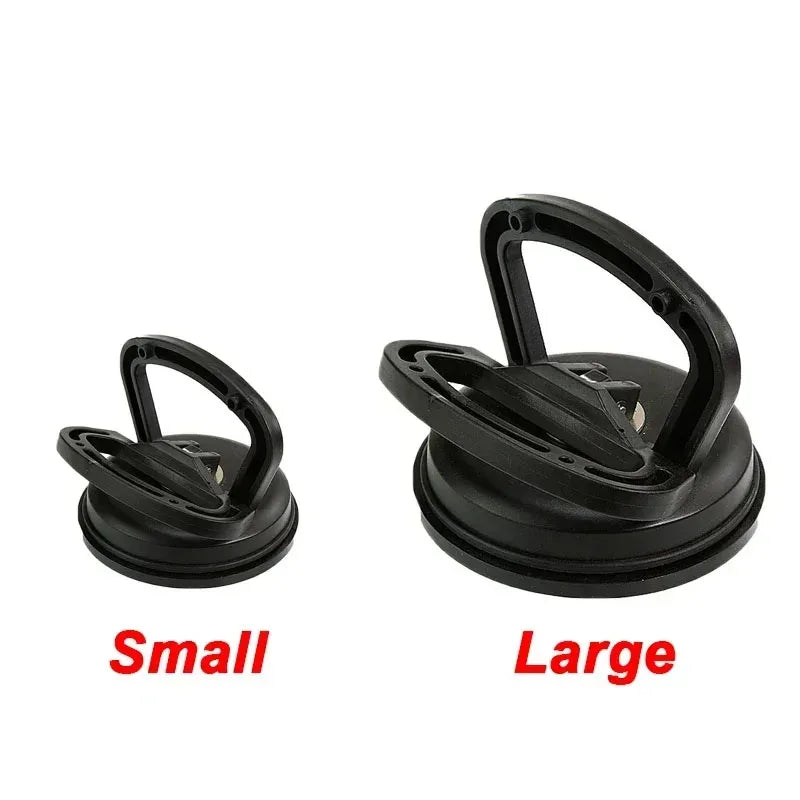 A pair of black car dent glass suction removal tools, labeled small and large.