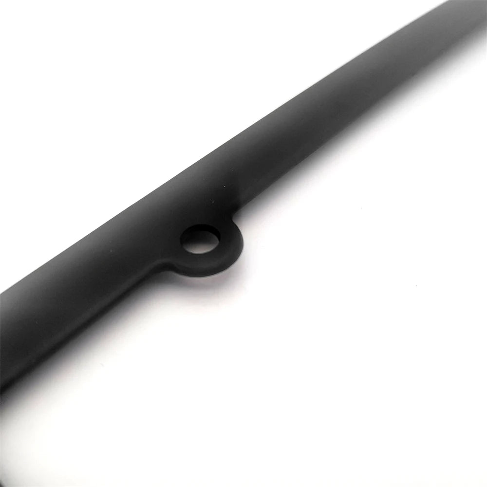 A close-up view of a black JDM racing style license plate frame decoration.