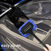 A black car windshield is being cleaned with a blue microfiber tool for easy cleaning.