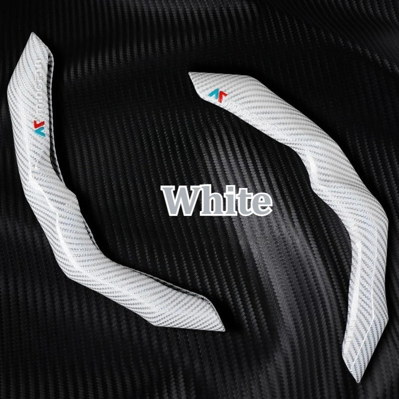 White carbon fiber steering wheel cover shown against a black background.