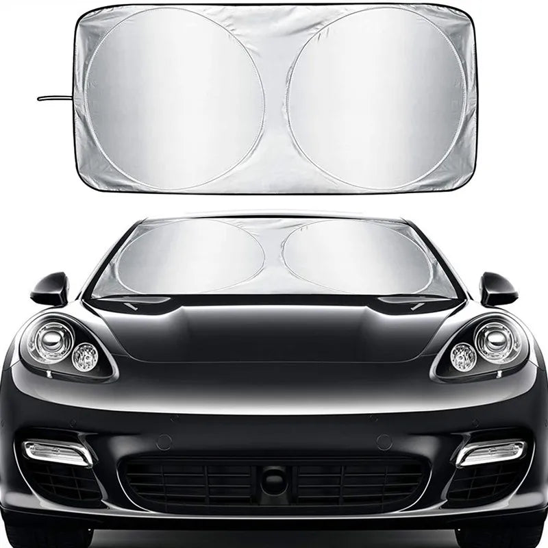 A folding car sunshade designed for windshield UV protection shown above a black car's hood.