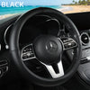 Black Mercedes steering wheel with leather trim and silver accents.