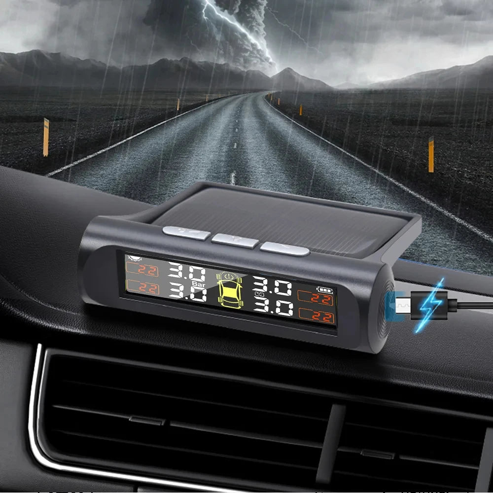 A black TPMS tire pressure monitoring system device is mounted on a car dashboard, with a stormy landscape in the background.