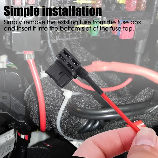 A hand is inserting a black automotive fuse adapter into the bottom slot of a fuse tap.