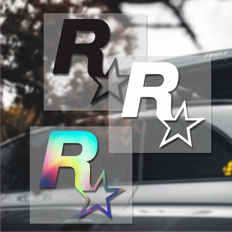 A close-up of a reflective star car decal featuring the letter R in various colors and styles on a vehicle window.