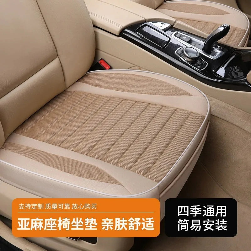 Tan flax breathable car seat covers installed in a vehicle interior.