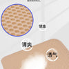 Close-up view of a beige honeycomb memory foam cushion designed for airflow and comfort.