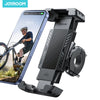 A black bike phone holder with a hidden tracker is shown next to a smartphone.