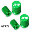Four green Jeep tire valve caps with textured metal inserts.