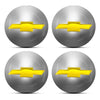 Four silver spherical hub center caps with gold-colored Chevrolet bowtie emblems.