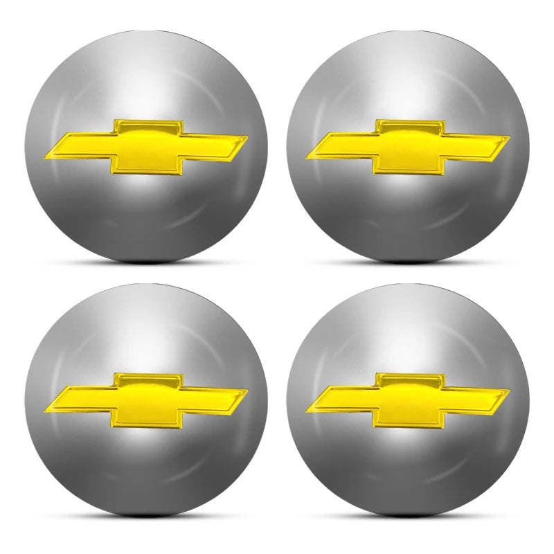 Four silver spherical hub center caps with gold-colored Chevrolet bowtie emblems.