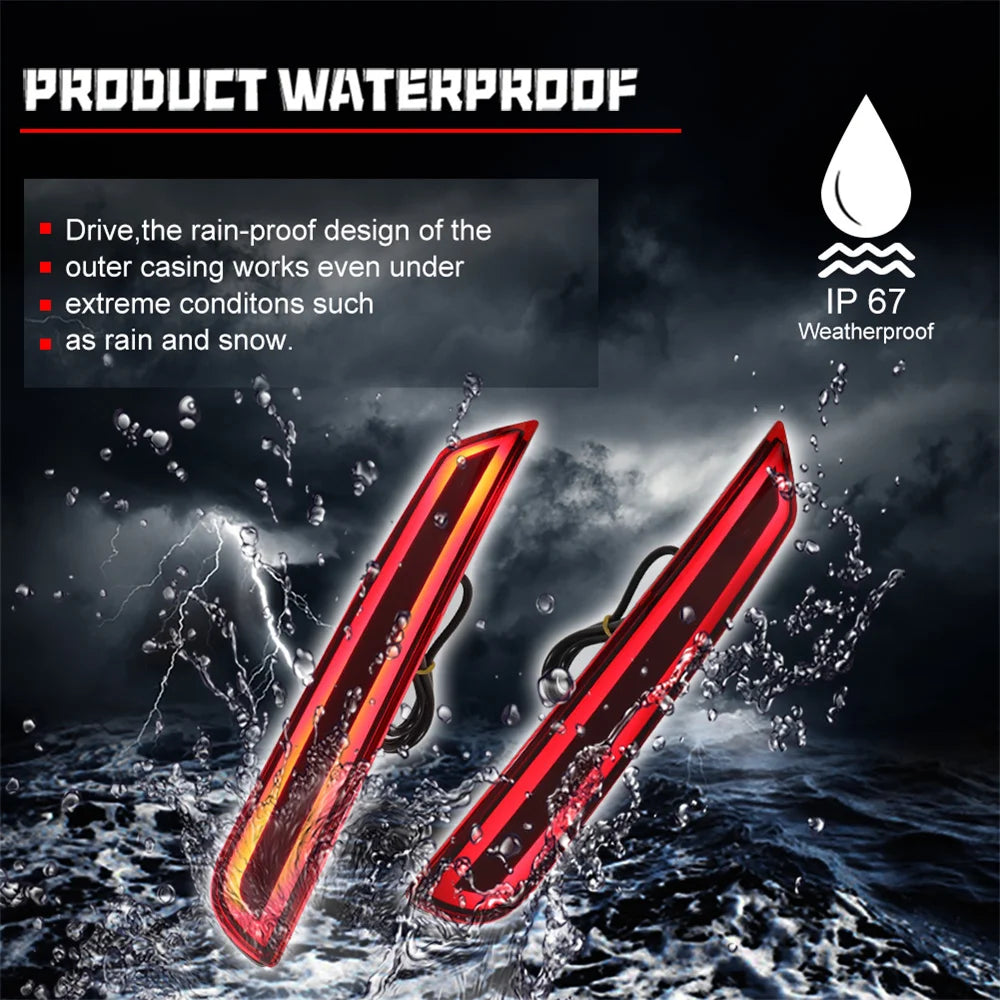 Two red LED rear bumper reflector lights are shown being washed by water.