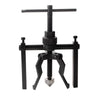 A black three-claw bearing puller tool with a long shaft and gripping arms.