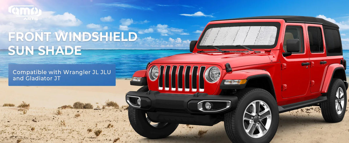 A red Jeep Wrangler or Gladiator truck with a front windshield sunshade installed.