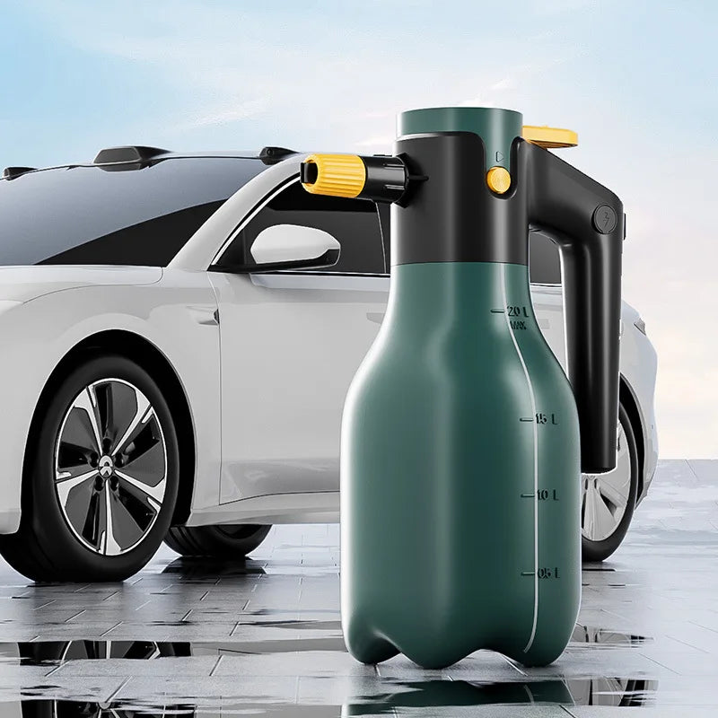 A green high-pressure electric foam spray bottle is positioned in front of a white car.