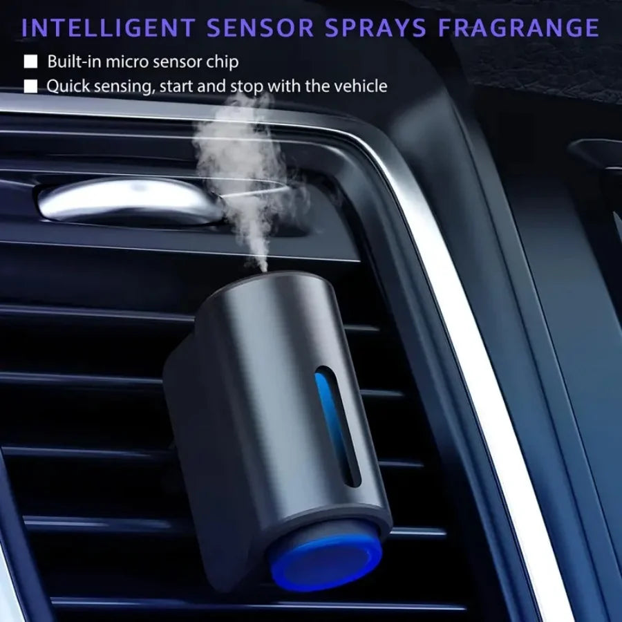 A close-up of an intelligent sensor spray fragrance dispenser installed in a car's air vent.