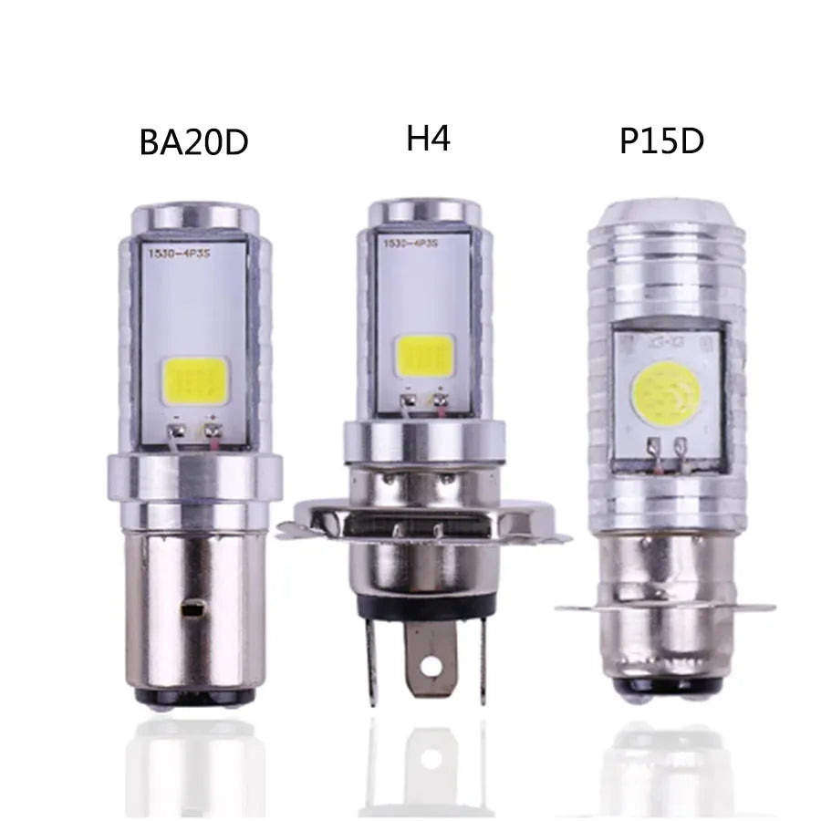 Three motorcycle headlight bulbs labeled BA20D, H4, and P15D displayed side by side.