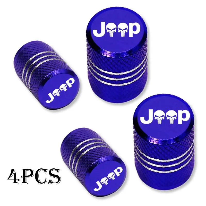 Four shiny blue Jeep tire valve caps with silver accents