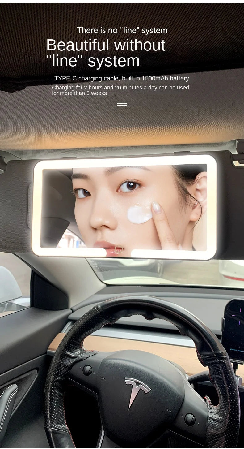 A touch screen vanity mirror is mounted in a car interior, showing a close-up of a person's face.