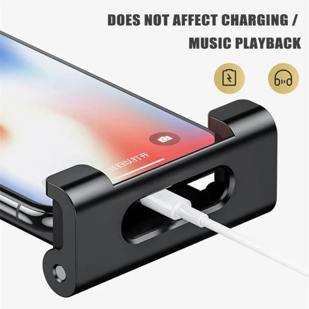A black universal rotating mount designed to secure a phone or tablet on a car headrest, ensuring charging and music playback